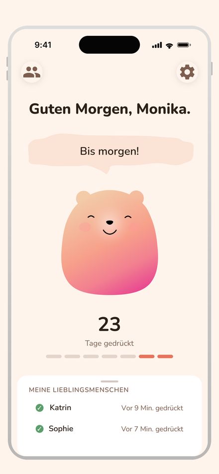 Handy mit der App: „Guten Morgen, Monika.“, ein lächelnder Bär, darunter die Lieblingsmenschen Katrin und Sophie